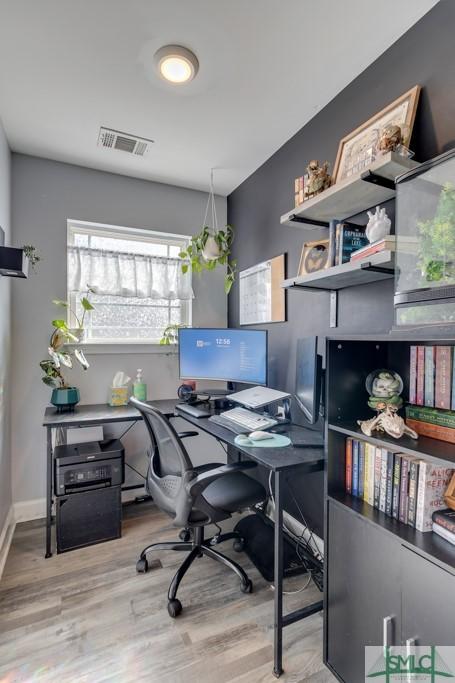 home office featuring light hardwood / wood-style floors