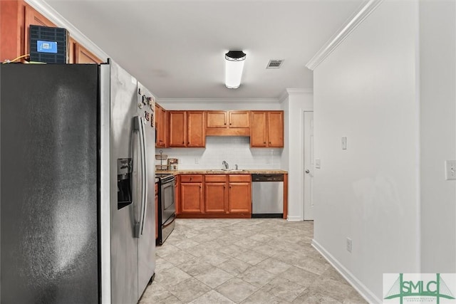 kitchen with tasteful backsplash, ornamental molding, stainless steel appliances, and sink