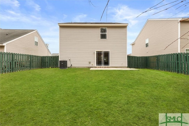 back of property with a yard, central AC, and a patio area