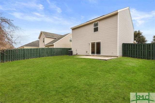 back of property with a patio, a lawn, and central air condition unit