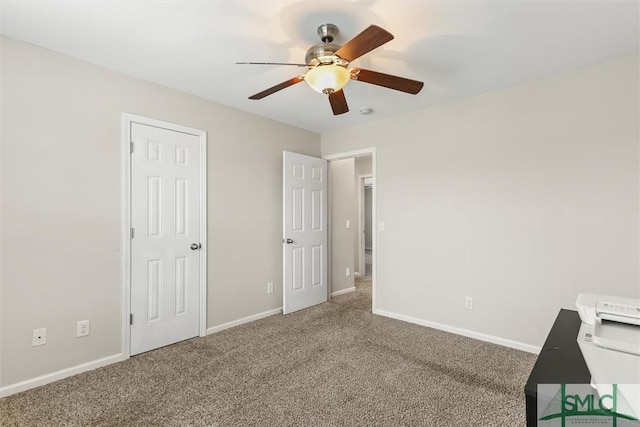 unfurnished bedroom featuring carpet floors and ceiling fan