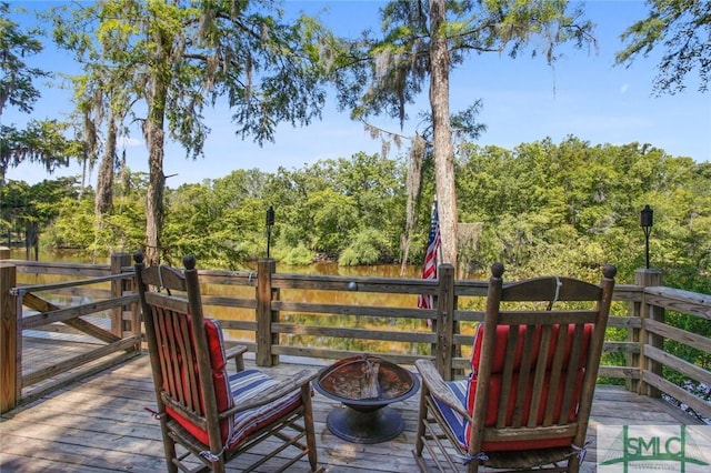 wooden deck with a fire pit