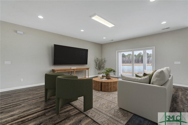 living room with dark hardwood / wood-style floors