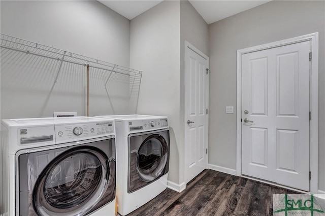 clothes washing area featuring dark hardwood / wood-style flooring and independent washer and dryer