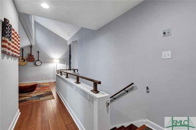 staircase with hardwood / wood-style flooring