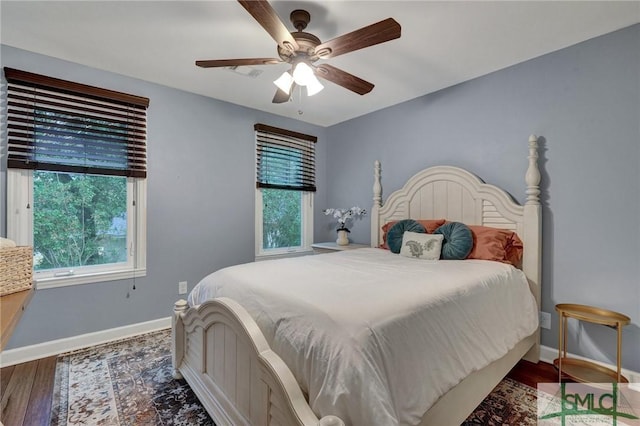 bedroom featuring hardwood / wood-style flooring and ceiling fan