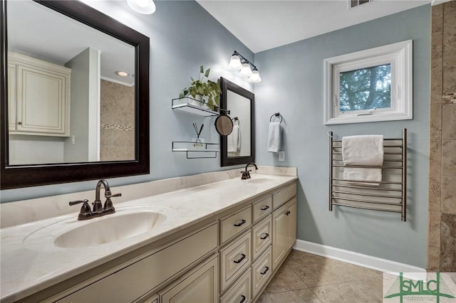 bathroom with vanity, radiator heating unit, and tile patterned floors