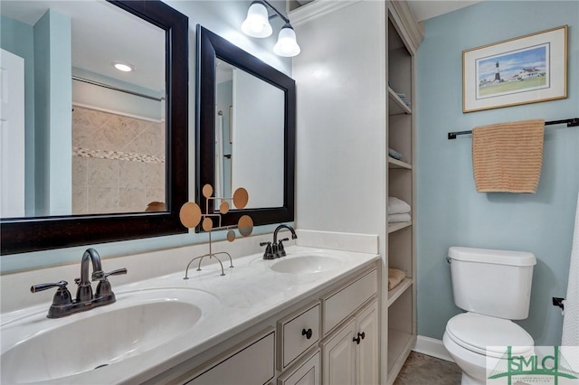 bathroom featuring vanity, tile patterned floors, and toilet