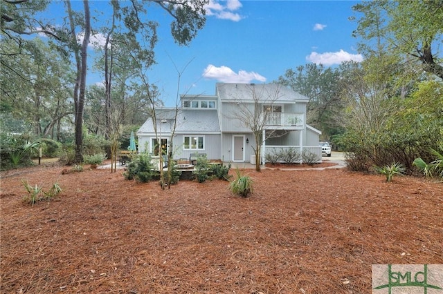 view of front of property with a balcony