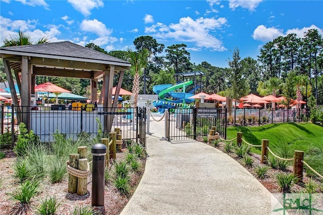 view of property's community featuring a gazebo, a yard, and a playground