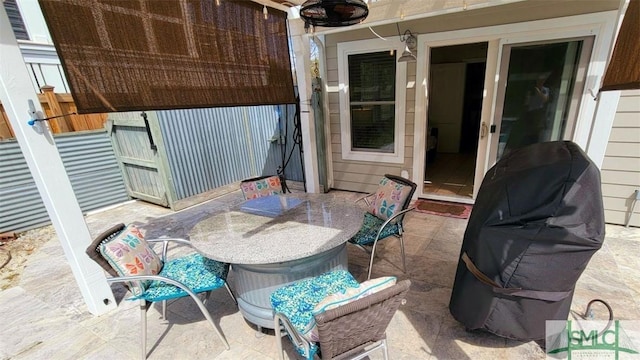 403 13th St, Tybee Island, GA 31328 - view of patio featuring a grill