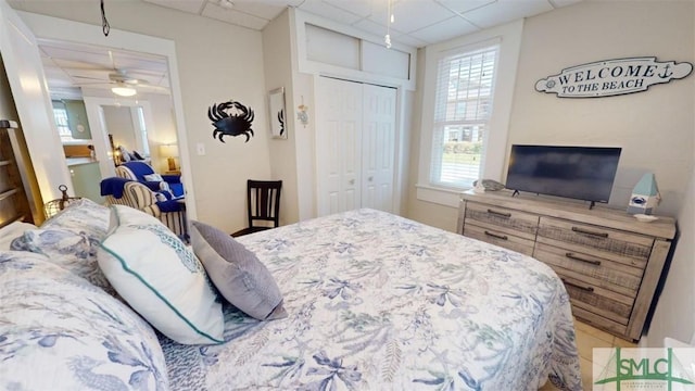 403 13th St, Tybee Island, GA 31328 - bedroom featuring a drop ceiling and a closet