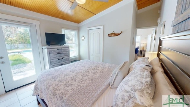 403 13th St, Tybee Island, GA 31328 - tiled bedroom featuring wood ceiling, ceiling fan, access to exterior, vaulted ceiling, and a closet