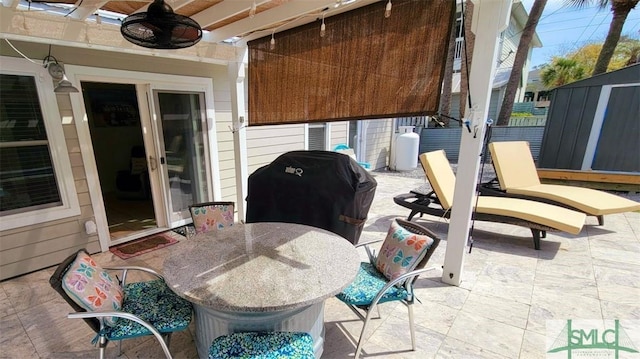 403 13th St, Tybee Island, GA 31328 - view of patio with ceiling fan and area for grilling