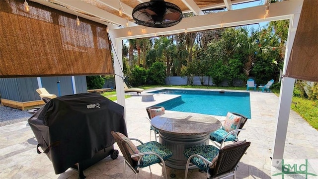 403 13th St, Tybee Island, GA 31328 - view of swimming pool with grilling area, ceiling fan, and a patio area