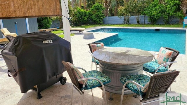 403 13th St, Tybee Island, GA 31328 - view of pool with a patio and area for grilling