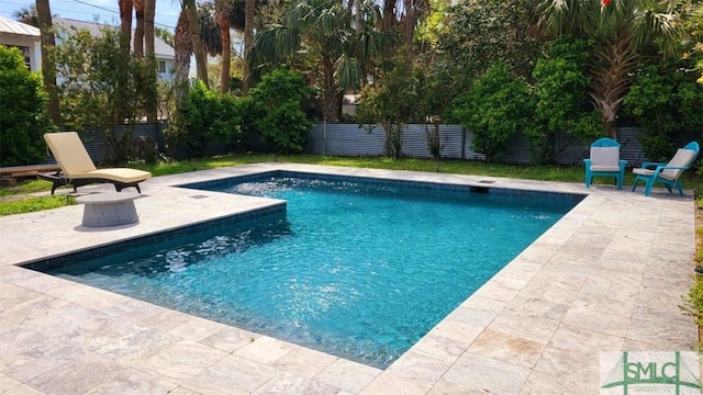 403 13th St, Tybee Island, GA 31328 - view of swimming pool with a patio area