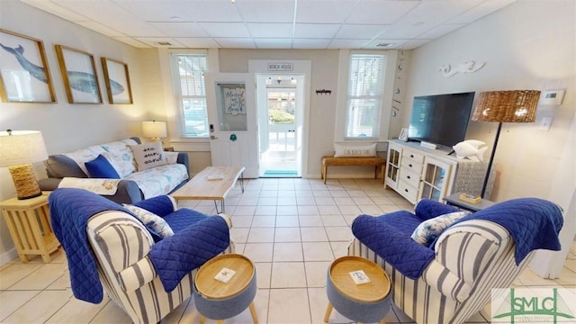 403 13th St, Tybee Island, GA 31328 - living room with plenty of natural light, light tile patterned floors, and a drop ceiling