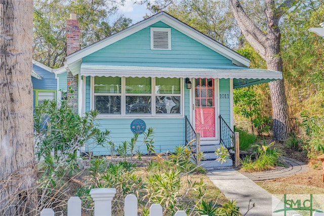 bungalow-style home with entry steps