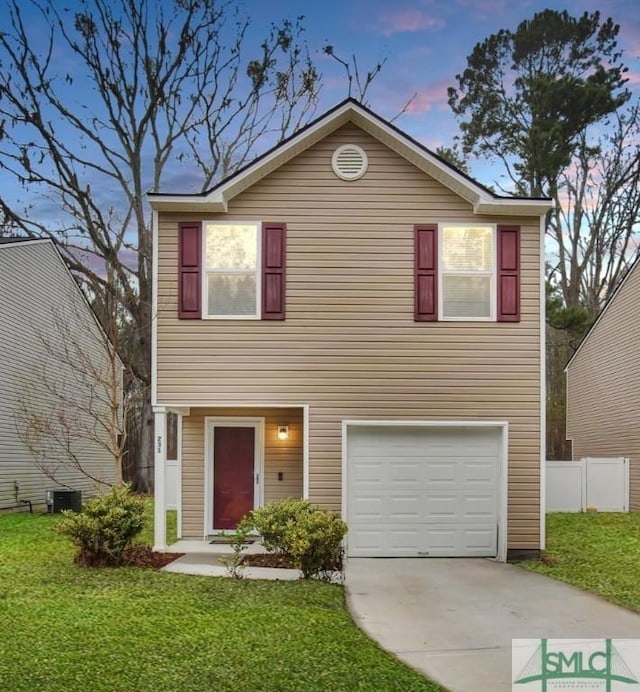 view of front of home featuring a yard, a garage, and central air condition unit