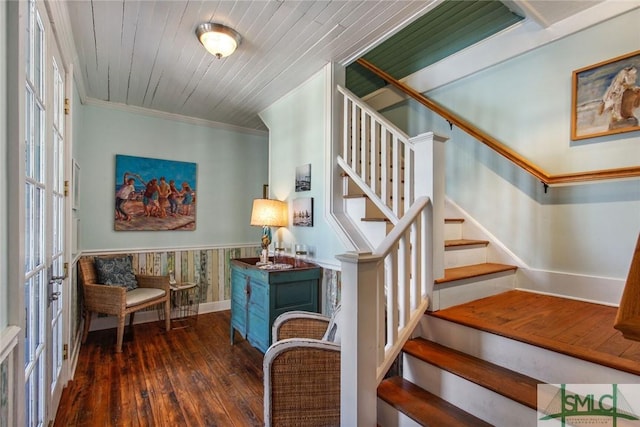 staircase featuring wood ceiling, hardwood / wood-style flooring, ornamental molding, and french doors