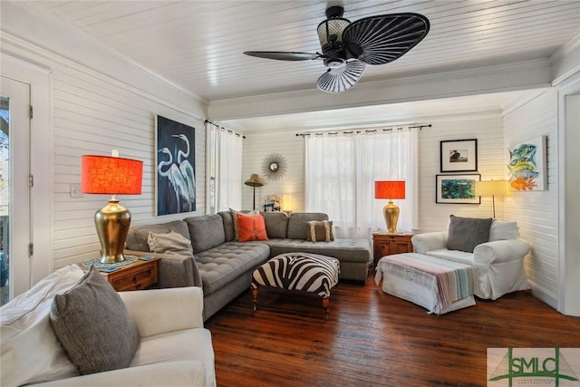 living room featuring ornamental molding, dark wood-type flooring, and ceiling fan