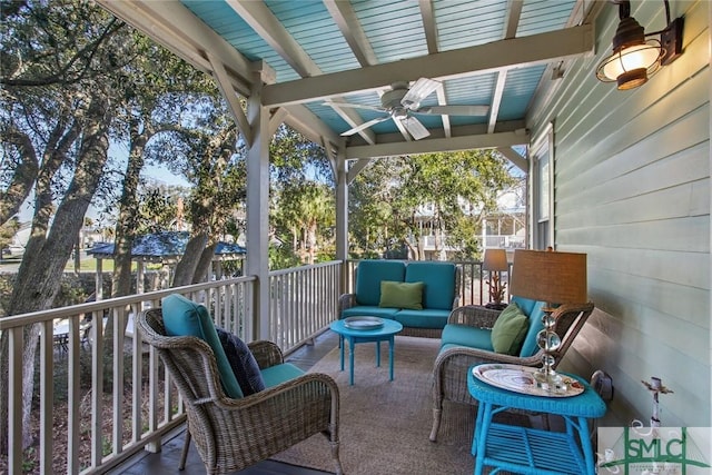 exterior space featuring ceiling fan and an outdoor living space