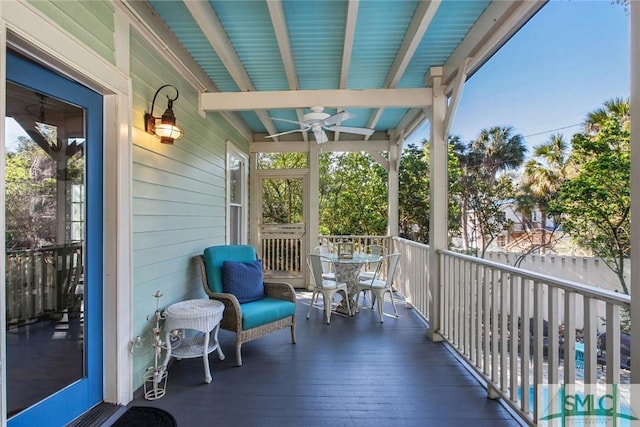 exterior space featuring ceiling fan