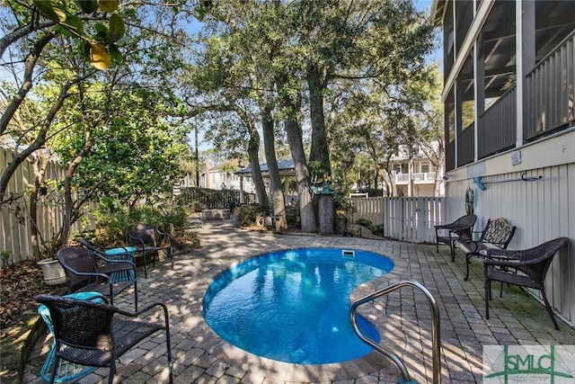 view of pool featuring a patio area