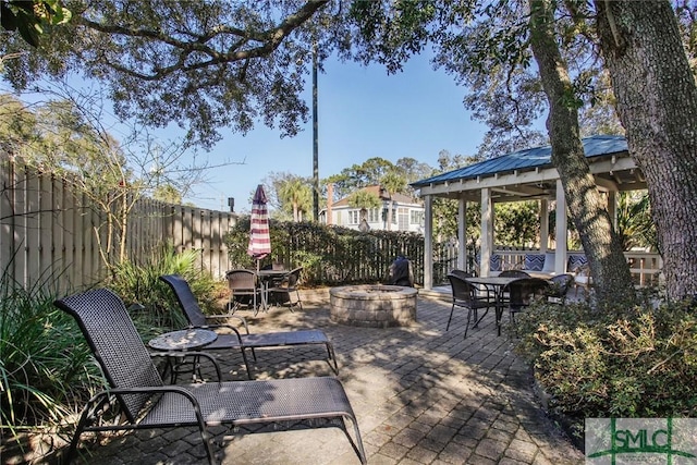 view of patio with a fire pit and a gazebo