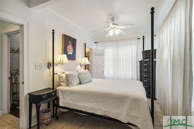 bedroom featuring ornamental molding, ceiling fan, and light tile patterned flooring