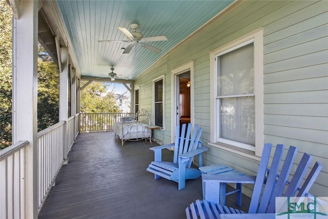 deck with covered porch and ceiling fan