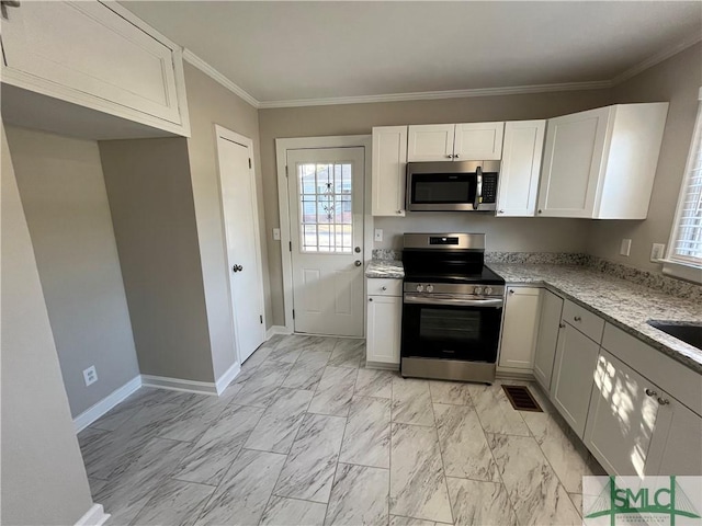 kitchen featuring stainless steel appliances, white cabinetry, ornamental molding, and light stone counters