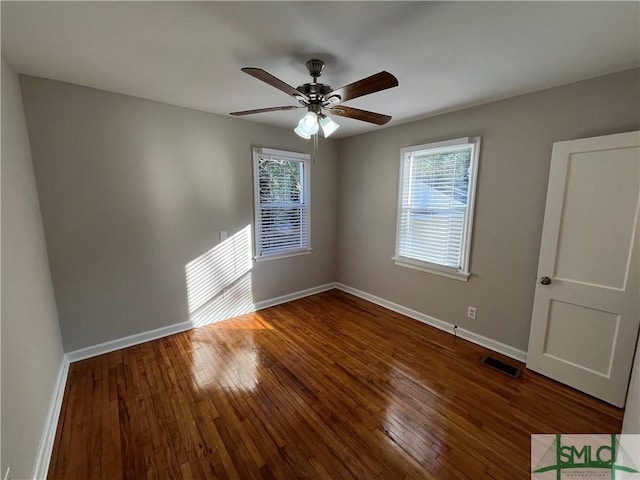 unfurnished bedroom featuring dark hardwood / wood-style floors and ceiling fan