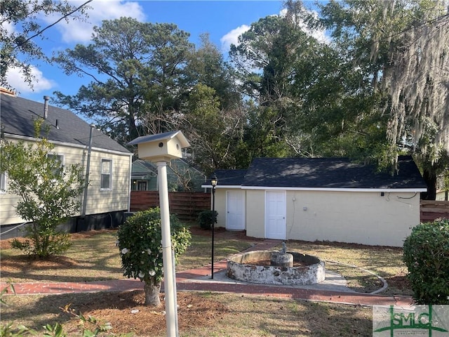 view of yard with a fire pit