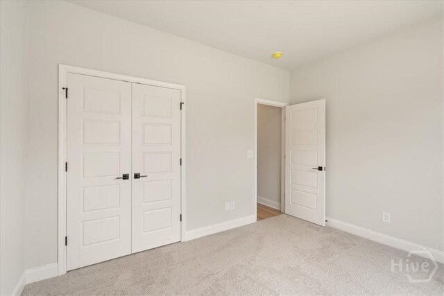330 Crosswinds Dr, Rincon, GA 31326 - unfurnished bedroom with carpet flooring, a closet, and baseboards