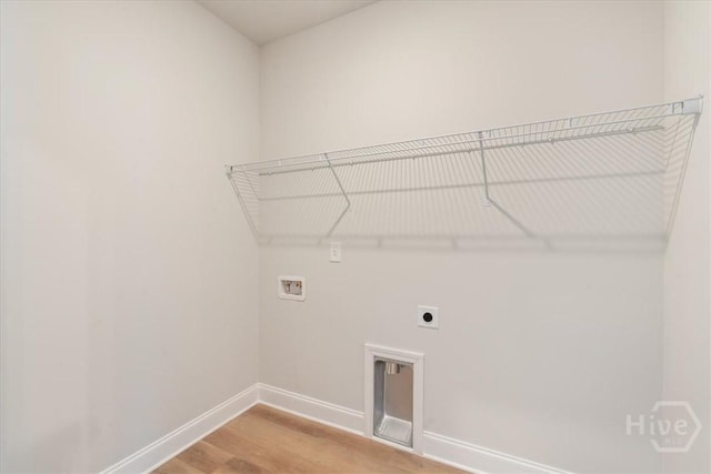 330 Crosswinds Dr, Rincon, GA 31326 - laundry area with hookup for a washing machine, baseboards, light wood-type flooring, and electric dryer hookup