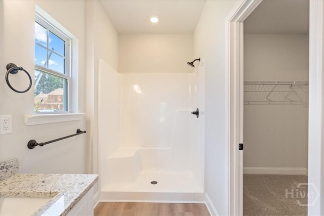 330 Crosswinds Dr, Rincon, GA 31326 - full bathroom featuring a shower, a walk in closet, baseboards, vanity, and recessed lighting