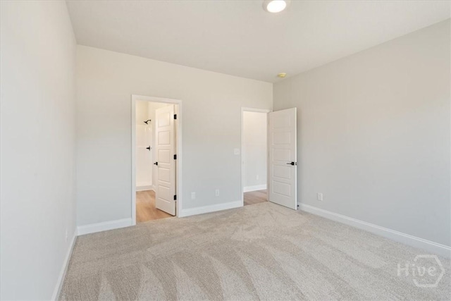 330 Crosswinds Dr, Rincon, GA 31326 - unfurnished bedroom featuring light colored carpet and baseboards