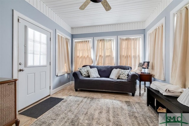 sunroom with ceiling fan