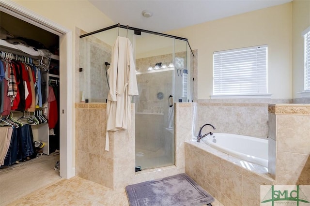 bathroom featuring independent shower and bath and tile patterned flooring