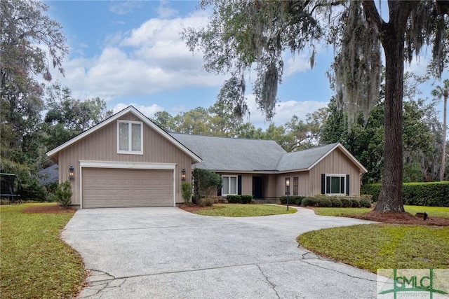 ranch-style home with a garage and a front yard