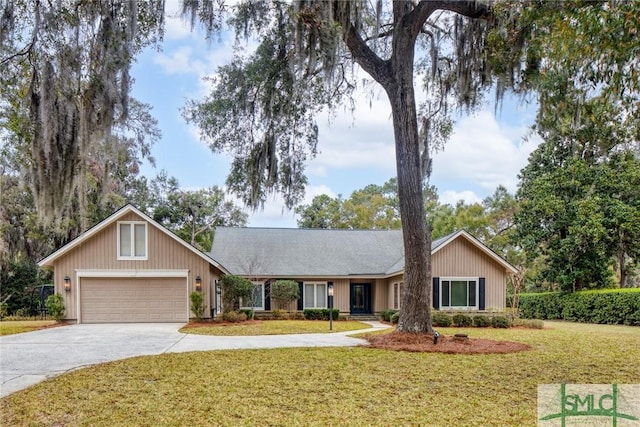 ranch-style house with a front yard, driveway, and an attached garage