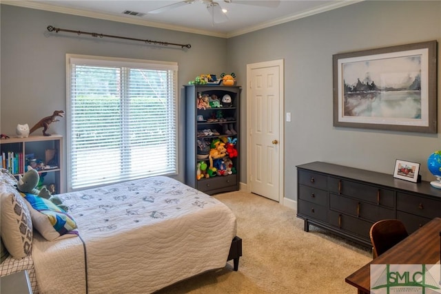 bedroom featuring ornamental molding, light colored carpet, and ceiling fan