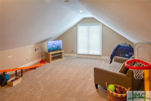 recreation room with lofted ceiling and carpet