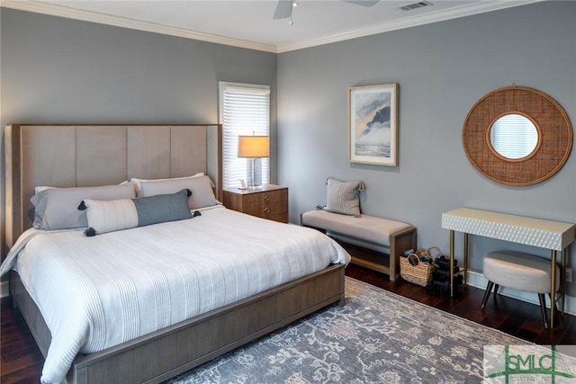 bedroom with dark wood-type flooring, ornamental molding, and ceiling fan