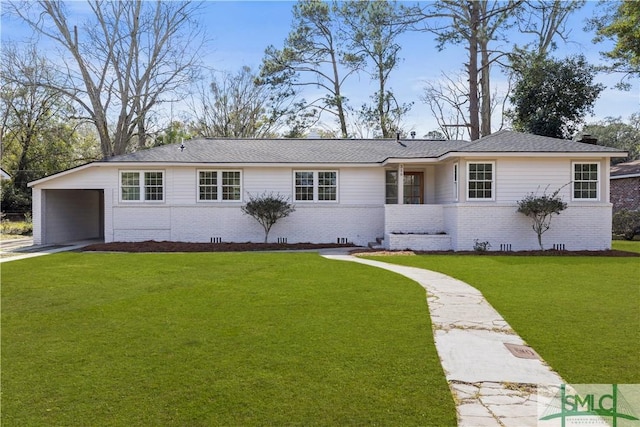 ranch-style house featuring driveway, brick siding, crawl space, and a front lawn