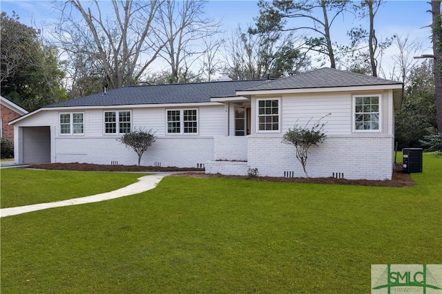 ranch-style home with brick siding, crawl space, a front lawn, and central air condition unit