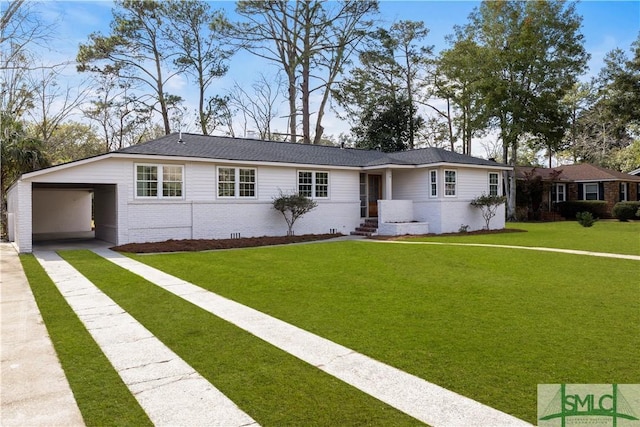 single story home featuring an attached garage, brick siding, concrete driveway, crawl space, and a front yard