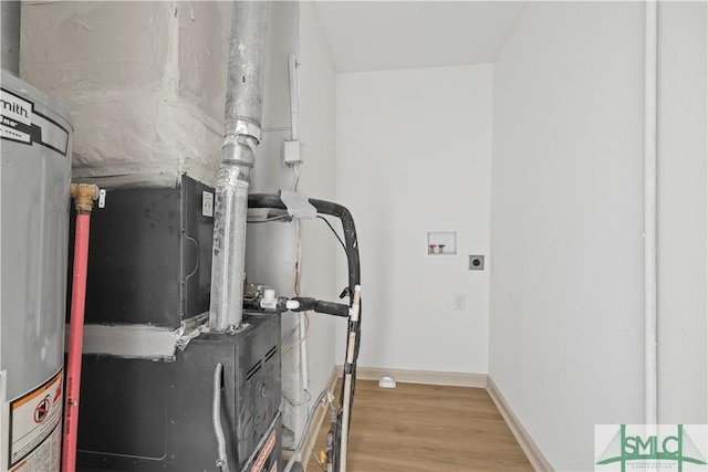 utility room featuring gas water heater